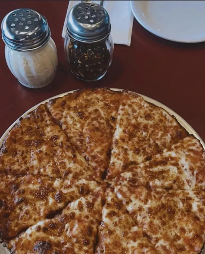 Cheese bar pizza on the table