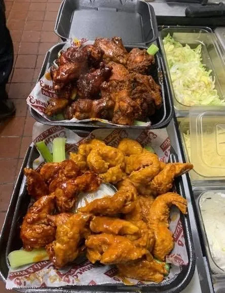 Trays of buffalo and BBQ wings